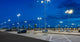 LED flood light illuminating commercial parking lot at night