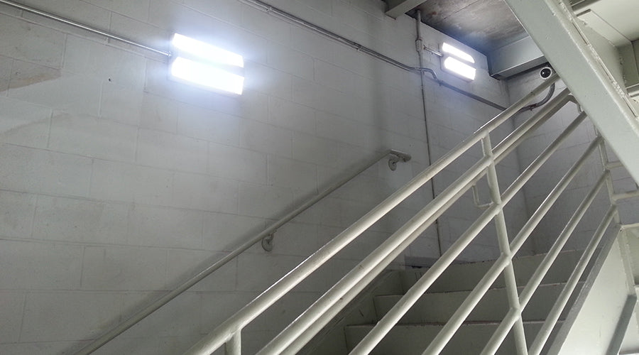 Commercial LED stairwell lighting fixture installed in stairwell
